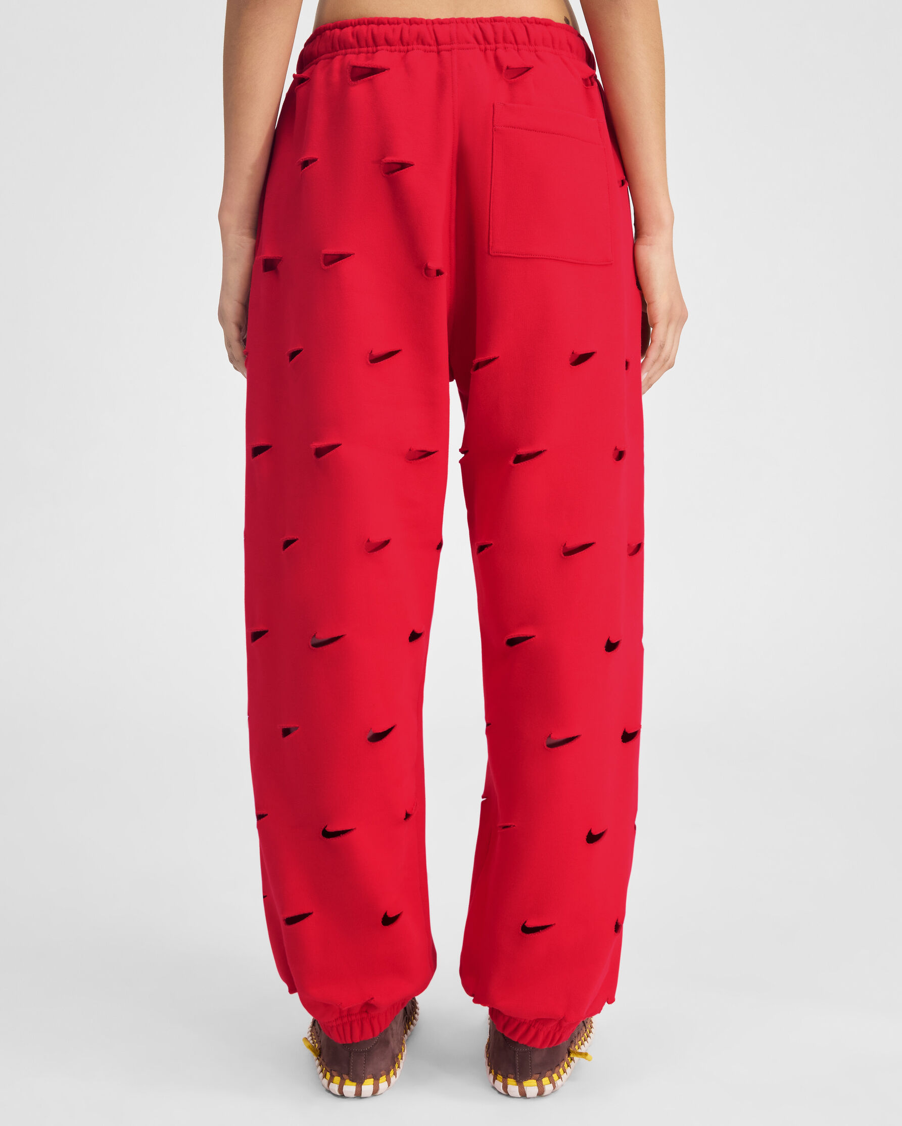 The Swoosh JACQUEMUS+NIKE track pants, Red | JACQUEMUS UAE